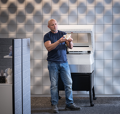 A man holding 3D printed model A man holding 3D printed model