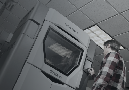 Fortus450 Stratasys Academy Online Man with Printer Fortus450 Stratasys Academy Online Man with Printer