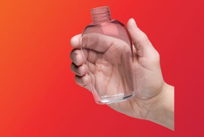 A hand holding 3Dprinted transparent bottle prototype A hand holding 3Dprinted transparent bottle prototype